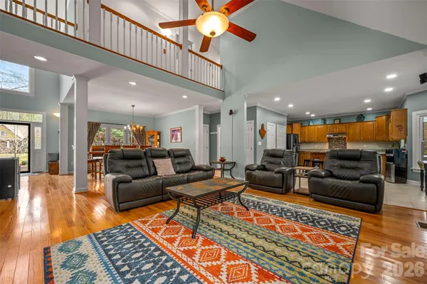 a living room with furniture kitchen view and a table