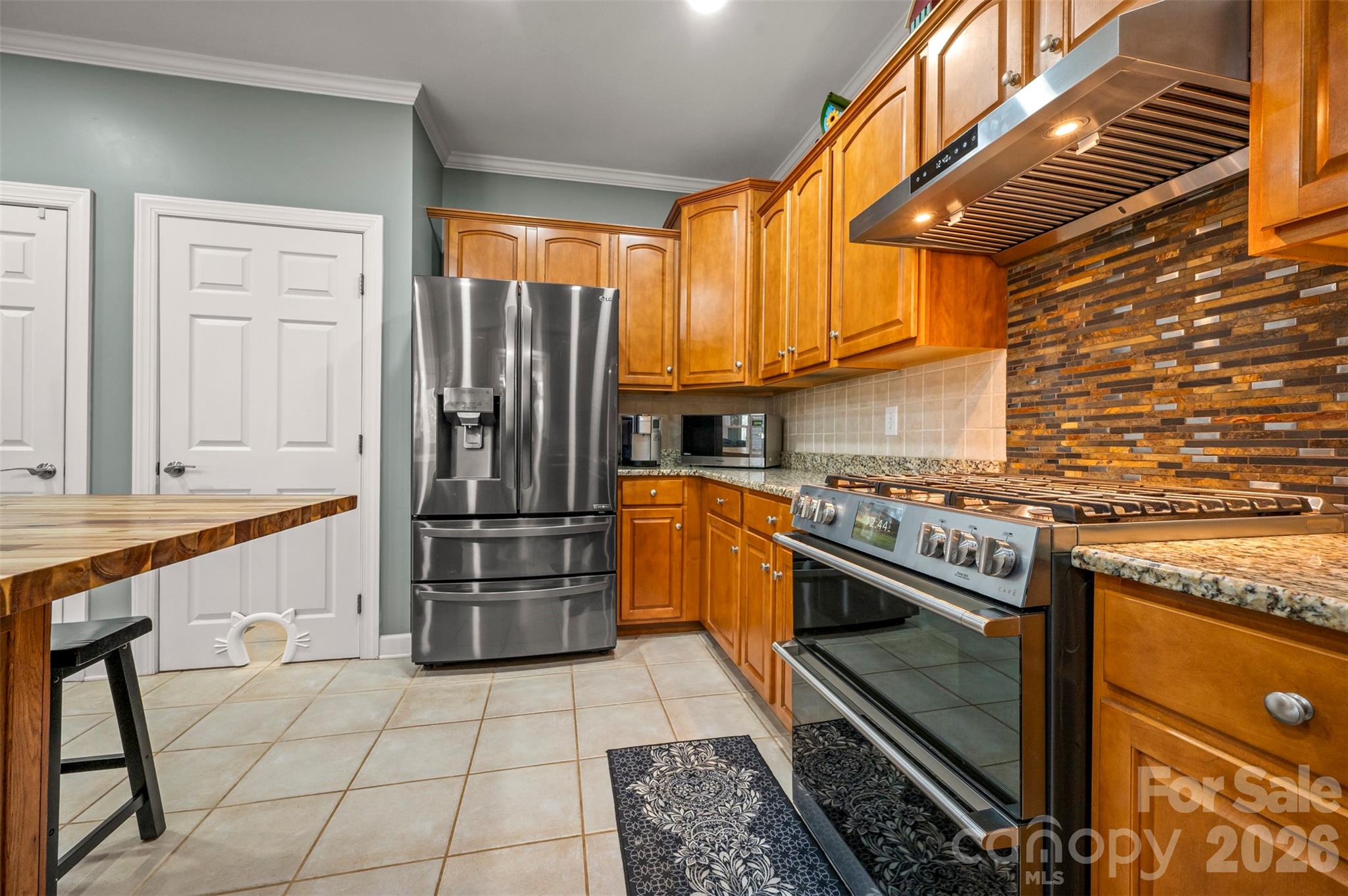 391 Chisholm Trail Rutherfordton, NC 28139 - Photo 10 of 39 a kitchen with stainless steel appliances granite countertop a refrigerator a stove and a sink