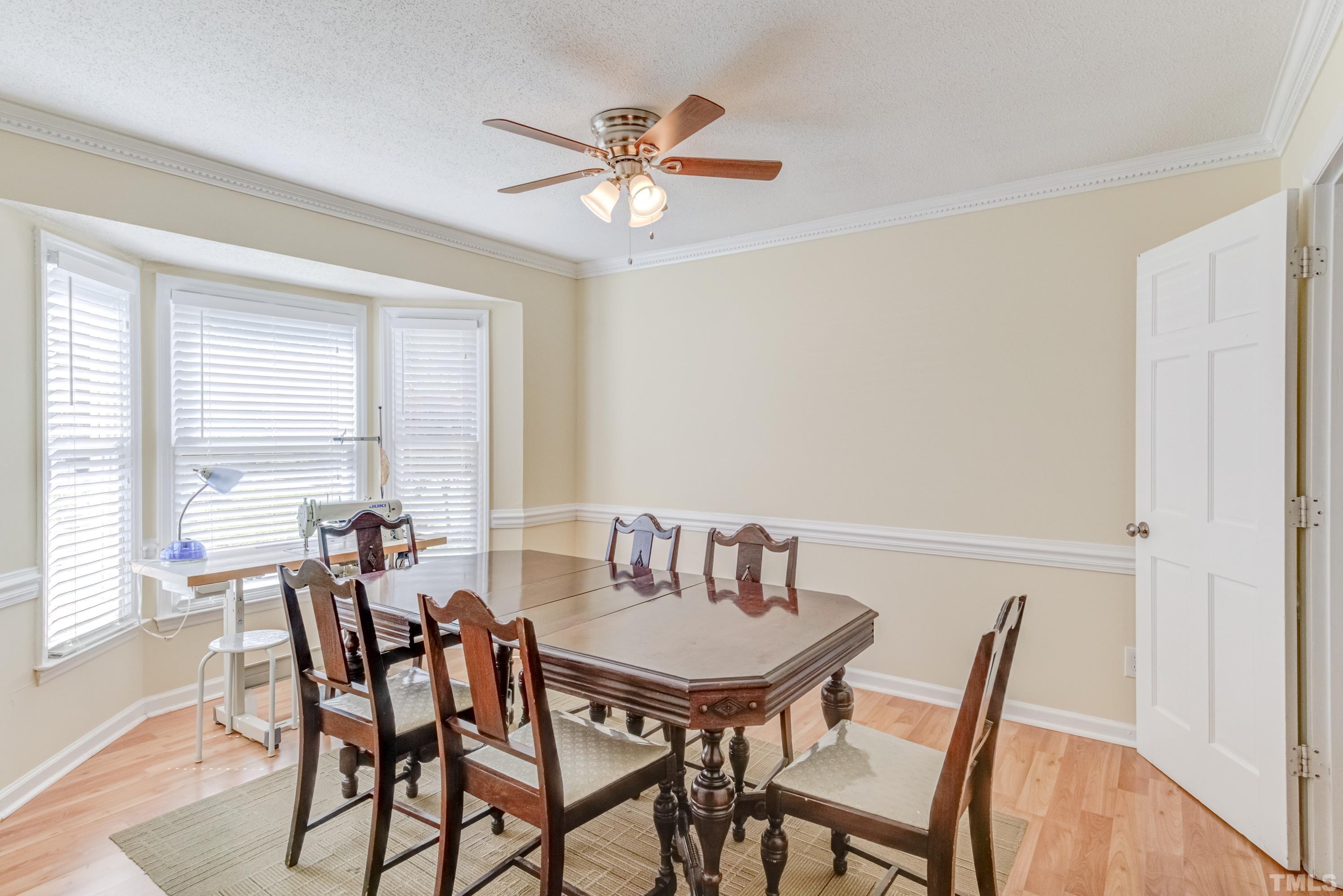 4625 Draper Road Raleigh, NC 27616 - Photo 4 of 25 a view of a dining room with furniture and window