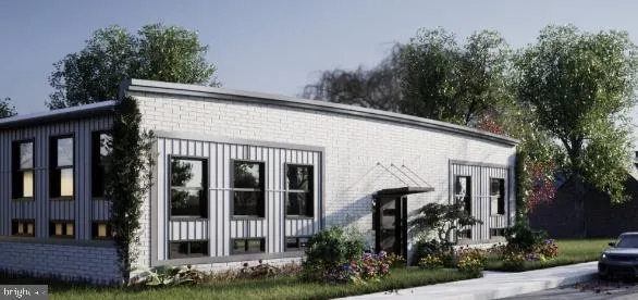 a view of a house with brick walls and flower plants