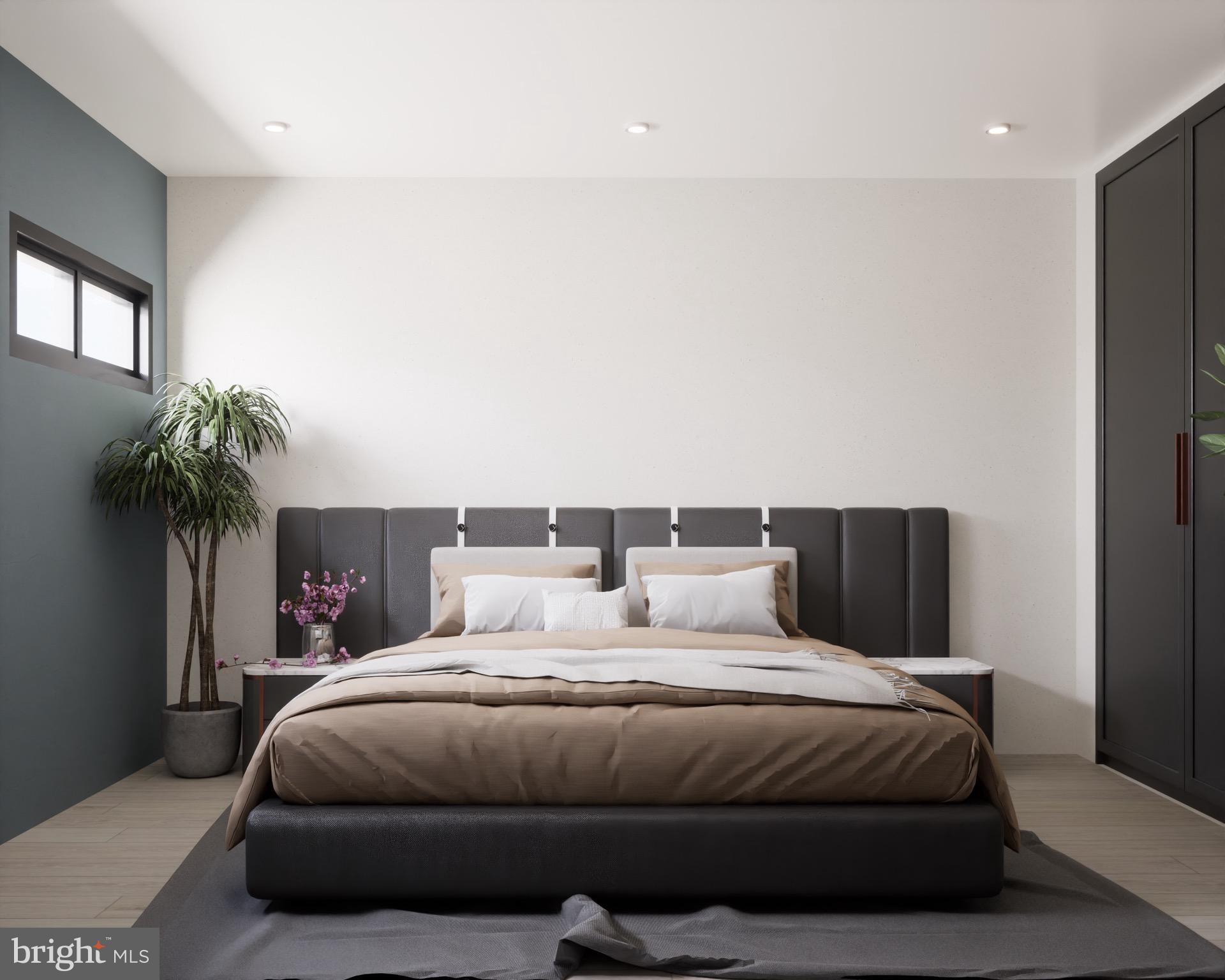 300 Penn Street, Unit 202 Pennsburg, PA 18073 - Photo 2 of 5 a bedroom with a large bed and a potted plant