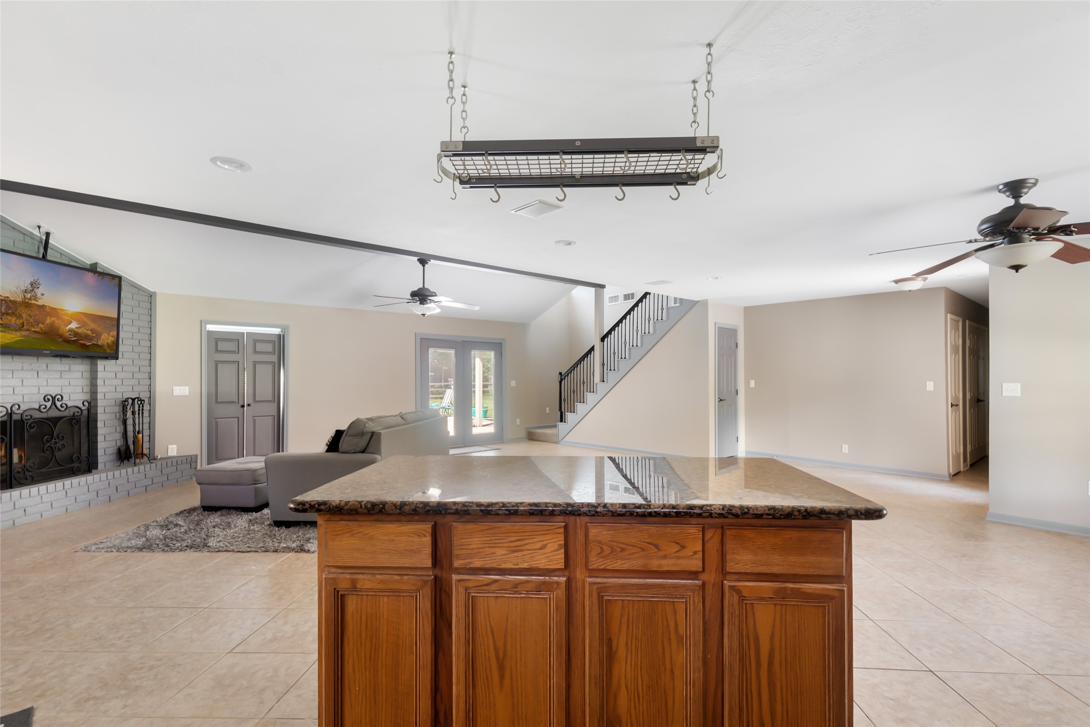 1300 Smith Road Huffman, TX 77336 - Photo 23 of 50 Seamless transition from the kitchen to the dining and family room enhances open-concept living.