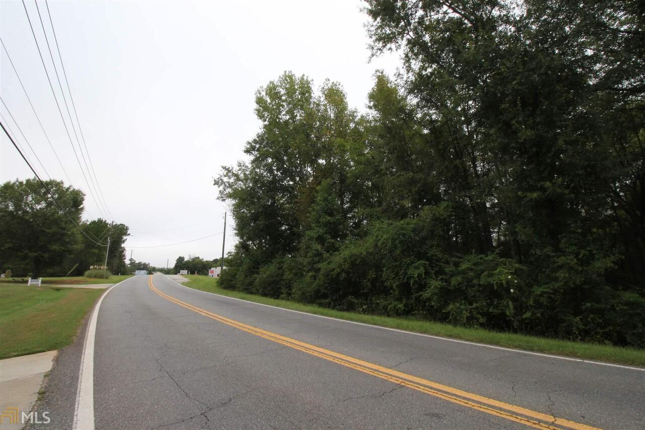 675 Dunlap Road Northeast Milledgeville, GA 31061 - Photo 5 of 7 a view of a road with a trees