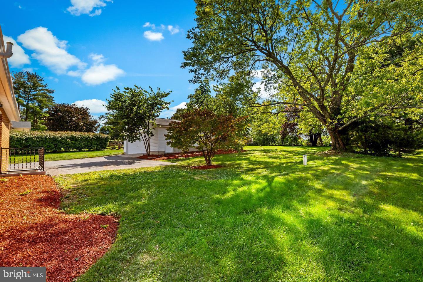 105 Warfieldsburg Road Westminster, MD 21157 - Photo 31 of 34 Lush green space under a bright sky.