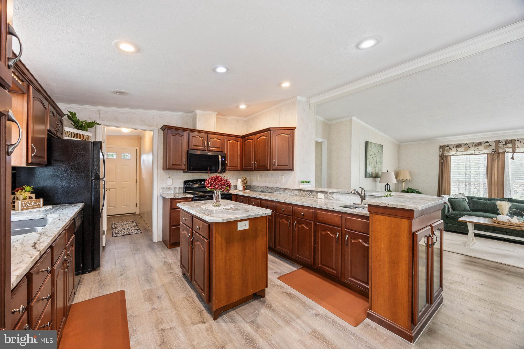 4258 Smith Road Salisbury, MD 21801 - Photo 20 of 43 a large kitchen with stainless steel appliances granite countertop a stove refrigerator and a sink