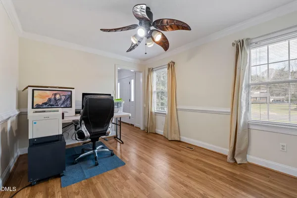 a view of entryway and hall with wooden floor