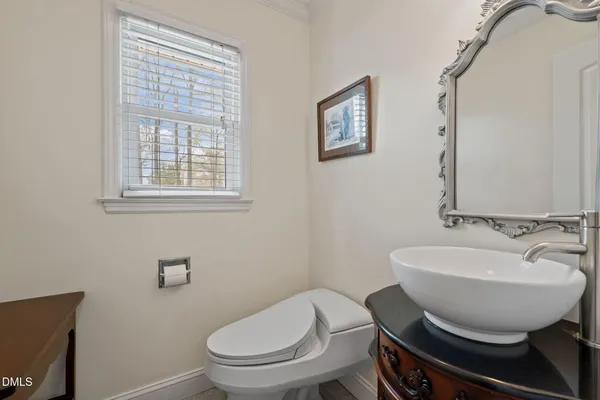 a large kitchen with stainless steel appliances granite countertop a sink and cabinets