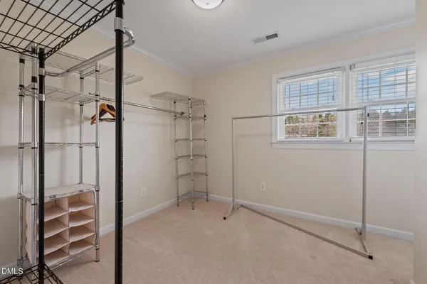 a bathroom with a bathtub shower sink mirror and toilet