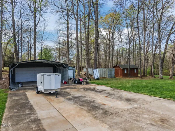 a bathroom with a granite countertop sink a toilet and mirror