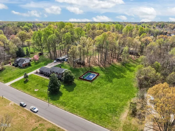 a bed room with a bed and a chandelier