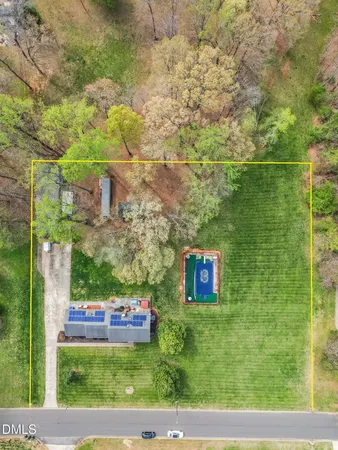 a view of a garden with a building in the background