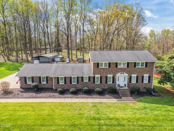 a view of a park with large trees