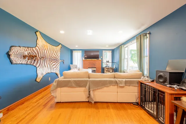 a living room with furniture fireplace and flat screen tv