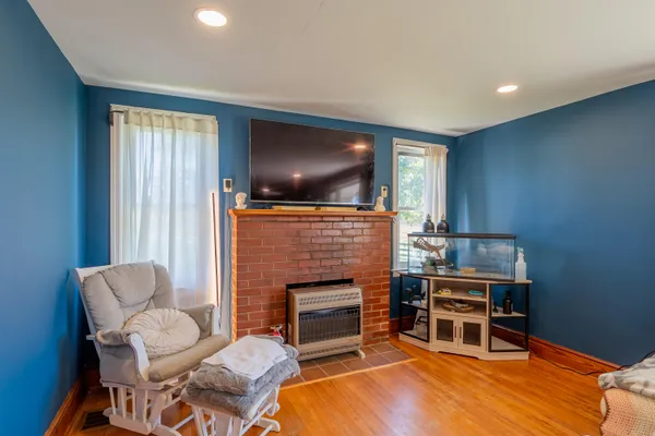 a living room with furniture window and wooden floor