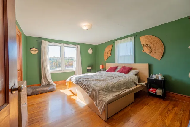 a view of a room with wooden walls