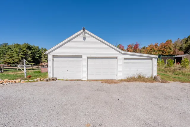 a backyard of a house with lots of trees