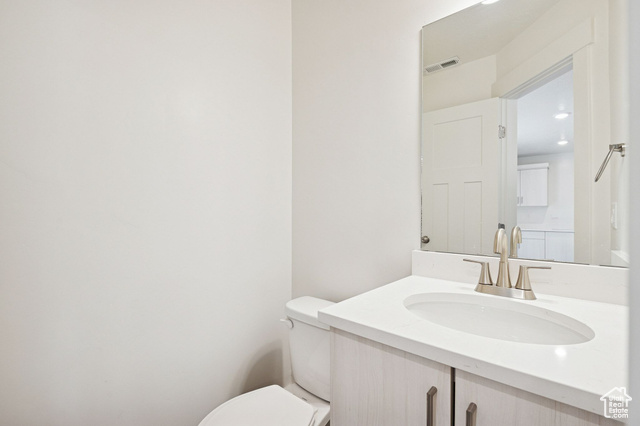 1615 North Angel Street, Unit I Layton, UT 84041 - Photo 20 of 56 Half bathroom with vanity and toilet