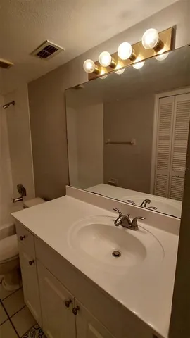 a bathroom with a bathtub and toilet