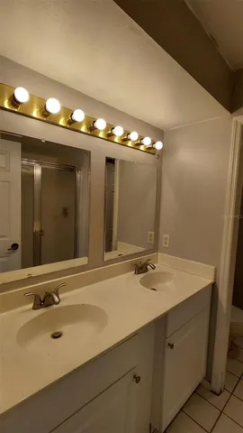 a bathroom with a glass shower door