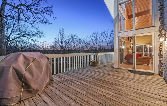 6914 Red Barn Road Crystal Lake, IL 60012 - Photo 12 of 63 a view of a house with backyard and wooden floor