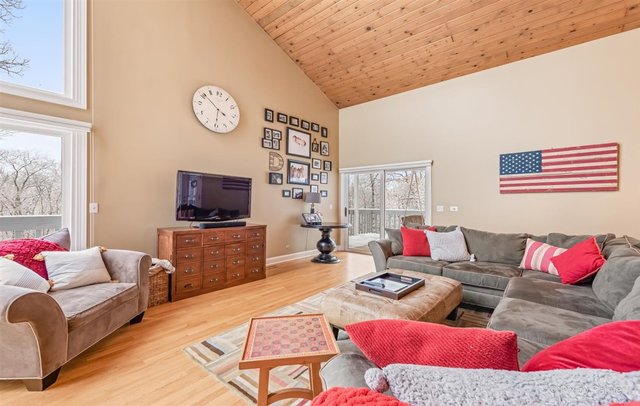 6914 Red Barn Road Crystal Lake, IL 60012 - Photo 17 of 63 a living room with furniture and a flat screen tv