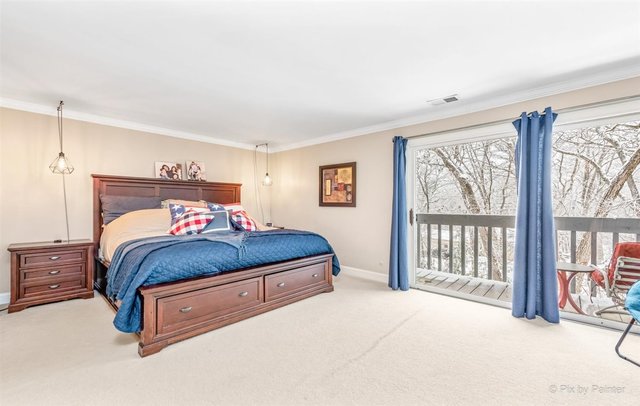 6914 Red Barn Road Crystal Lake, IL 60012 - Photo 44 of 63 a bedroom with a large bed and a large window