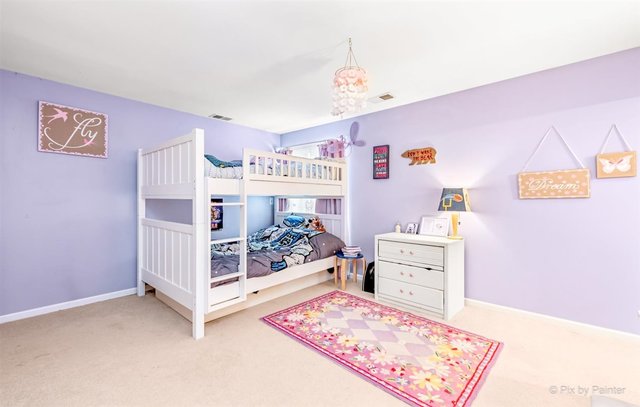 6914 Red Barn Road Crystal Lake, IL 60012 - Photo 46 of 63 a bed room with a bed and a baby bed