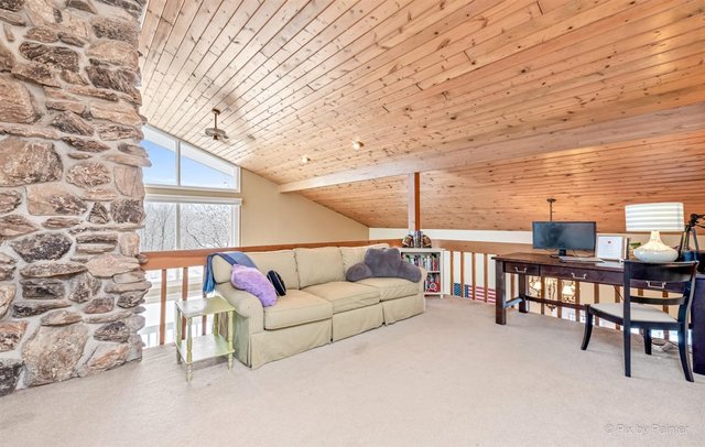 6914 Red Barn Road Crystal Lake, IL 60012 - Photo 51 of 63 a living room with furniture a ceiling fan and a wooden floor