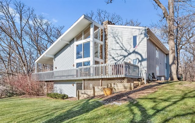 6914 Red Barn Road Crystal Lake, IL 60012 - Photo 56 of 63 a view of a house with a yard and a wooden deck