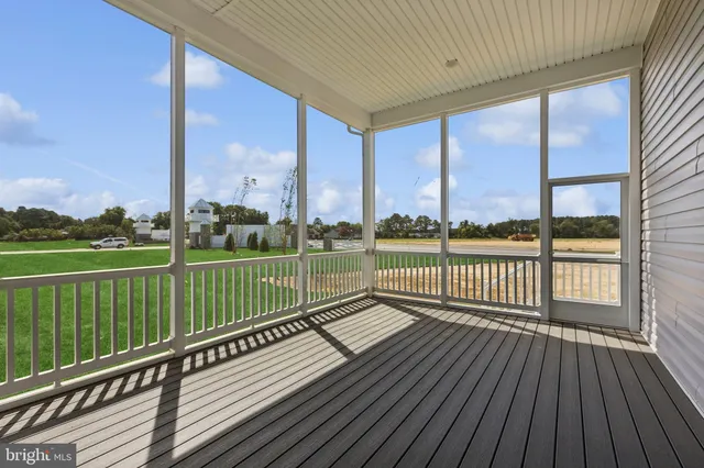 a view of a balcony with wooden floor