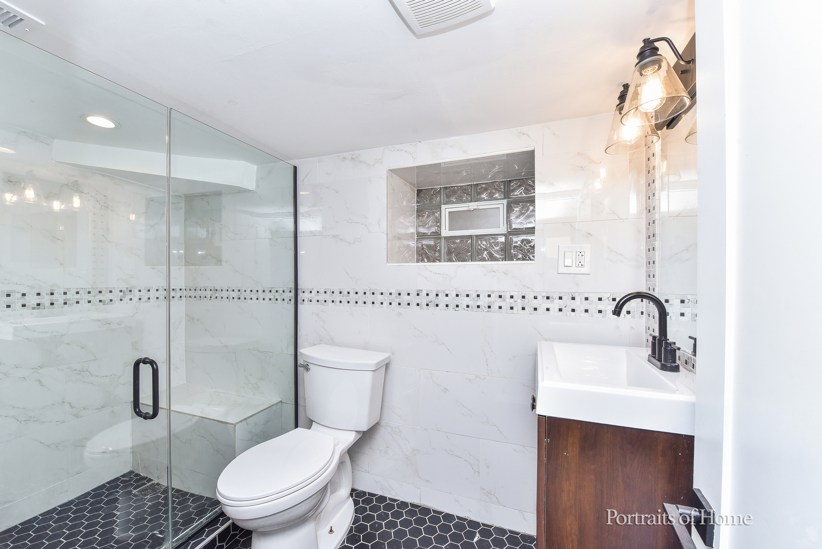 3501 West Le Moyne Street, Unit 1 Chicago, IL 60651 - Photo 19 of 27 a bathroom with a sink toilet and shower