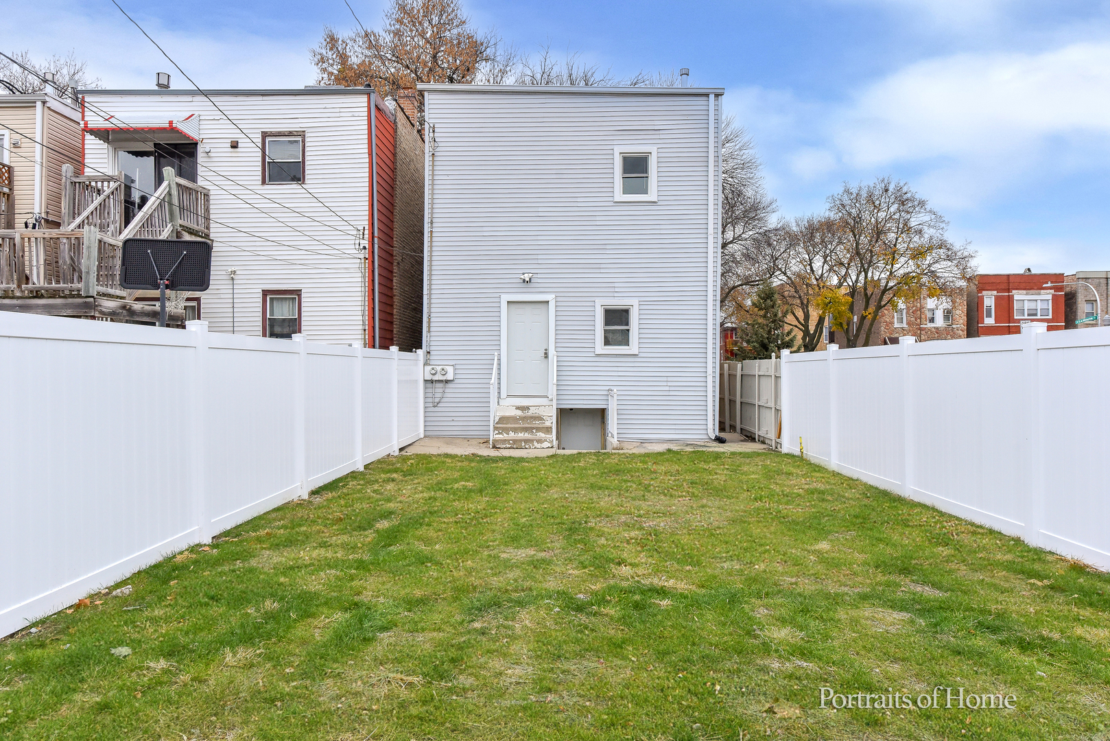 3501 West Le Moyne Street, Unit 1 Chicago, IL 60651 - Photo 22 of 27 a view of a house with backyard and a tree