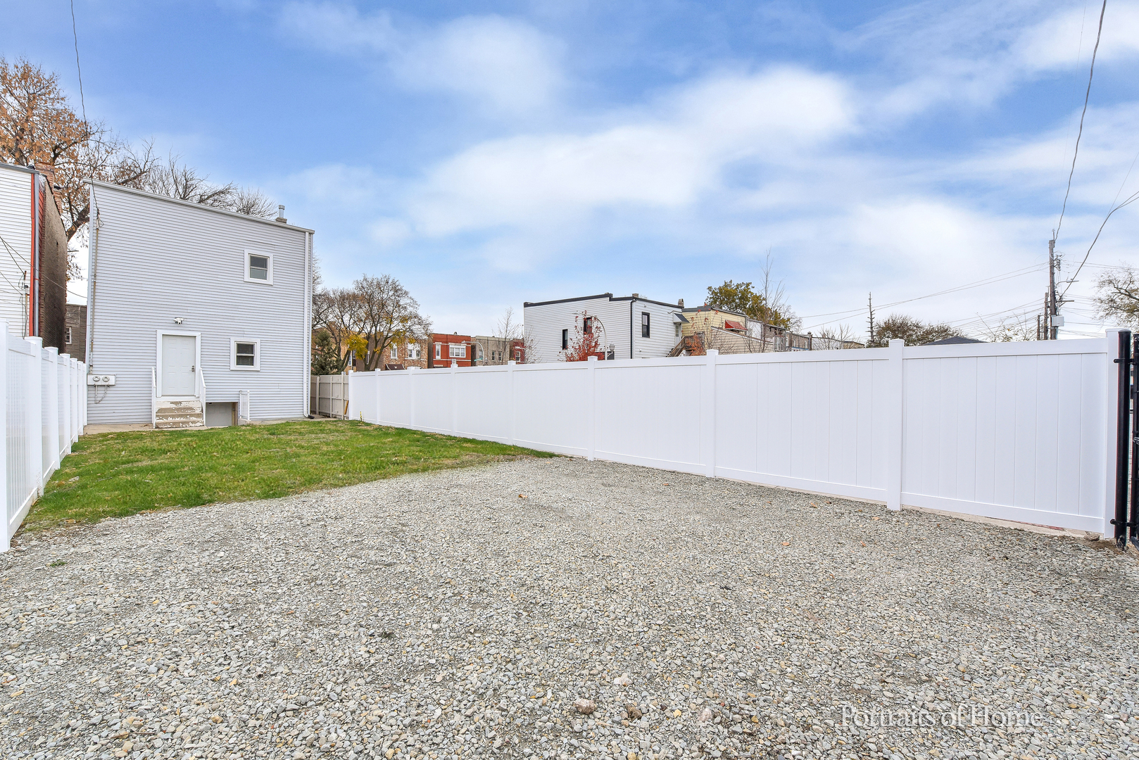 3501 West Le Moyne Street, Unit 1 Chicago, IL 60651 - Photo 23 of 27 a view of a dry yard with large trees