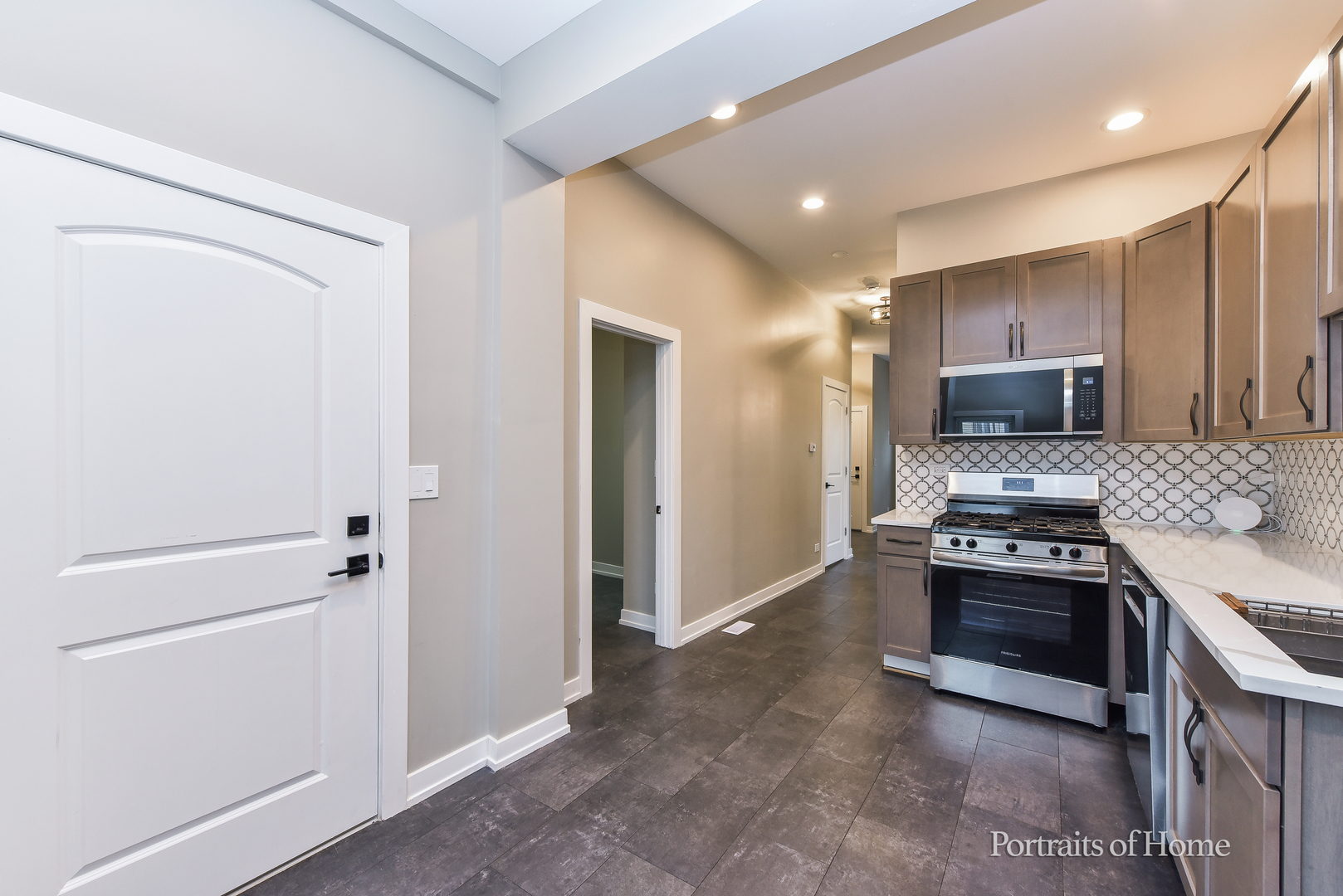 3501 West Le Moyne Street, Unit 1 Chicago, IL 60651 - Photo 9 of 27 a kitchen with a refrigerator sink and stove