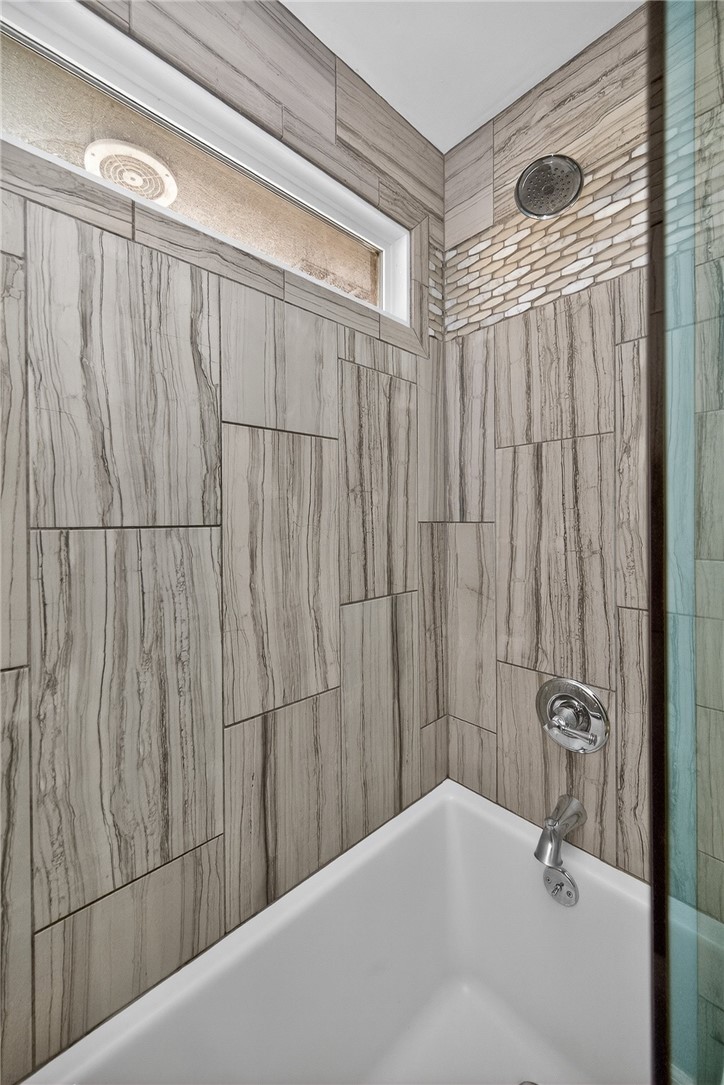 4747 Fawnwood Road Dayton, OH 45429 - Photo 42 of 58 This bathroom features a contemporary shower with sleek fixtures and elegant tile work.