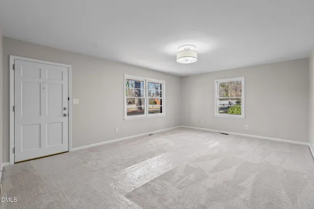 an empty room with windows