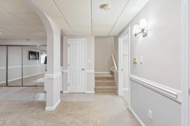 a view of a porch with wooden floor in front of a house