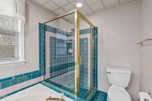 a view of a porch with a wooden fence