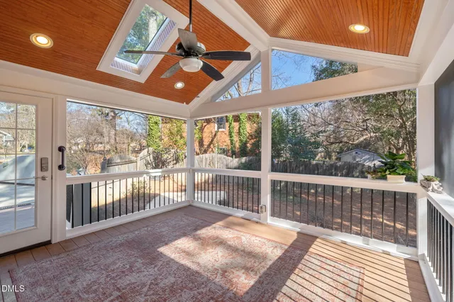 a view of balcony with wooden floor