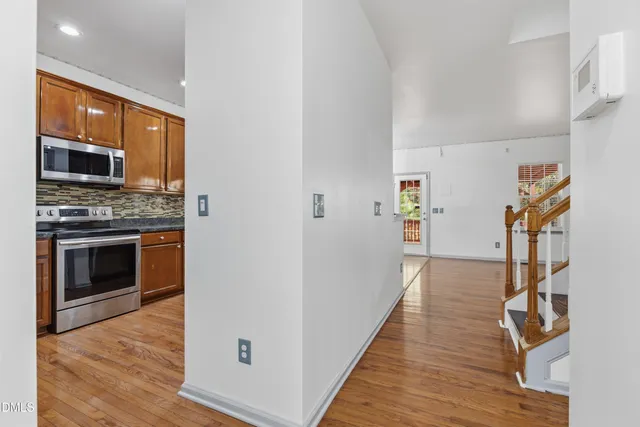 a view of a kitchen from a hallway