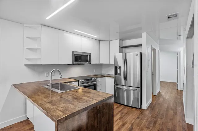 a bathroom with a sink toilet and mirror