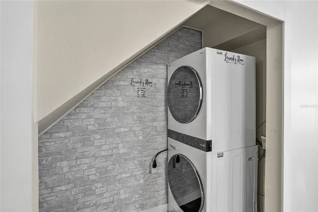 a kitchen with kitchen island a counter top space and stainless steel appliances