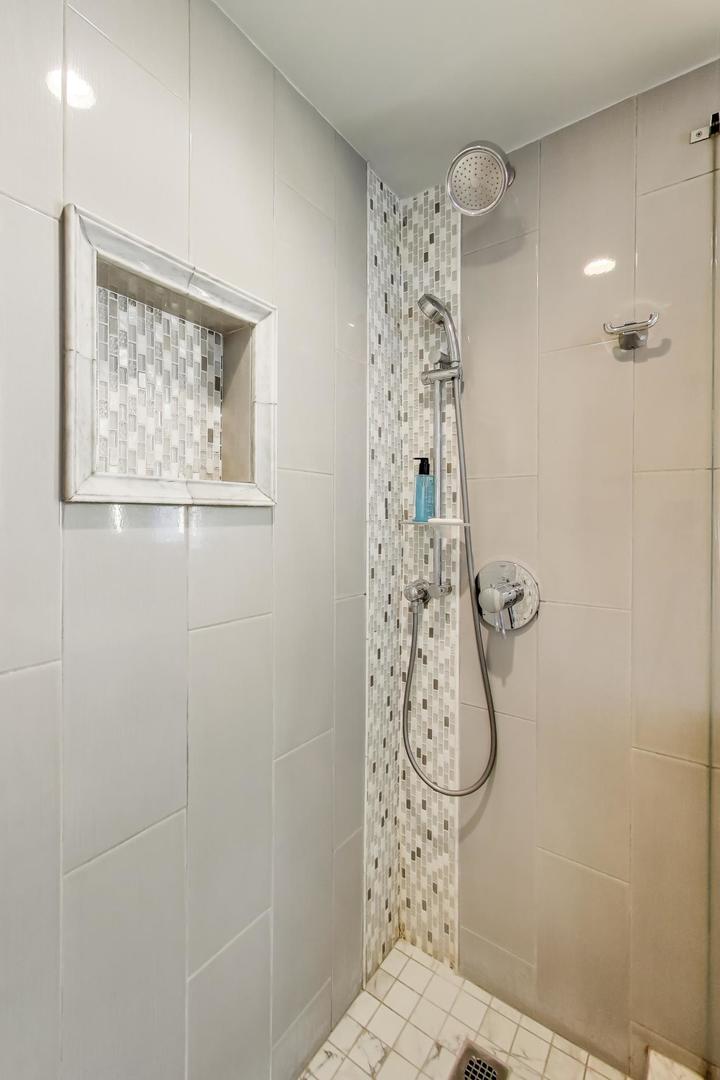 40 East Cedar Street, Unit 18B Chicago, IL 60611 - Photo 13 of 24 a bathroom with a shower