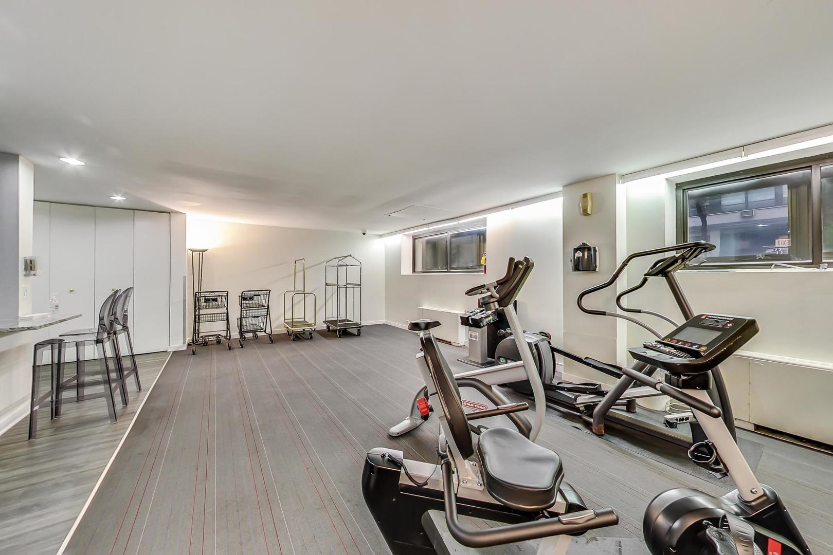 40 East Cedar Street, Unit 18B Chicago, IL 60611 - Photo 22 of 24 a view of a room with gym equipment
