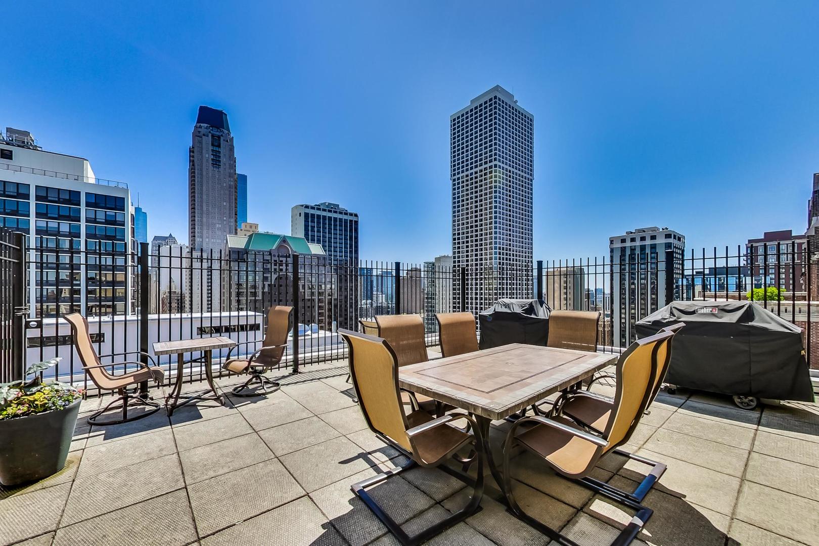 40 East Cedar Street, Unit 18B Chicago, IL 60611 - Photo 24 of 24 a view of balcony with two chairs and a table