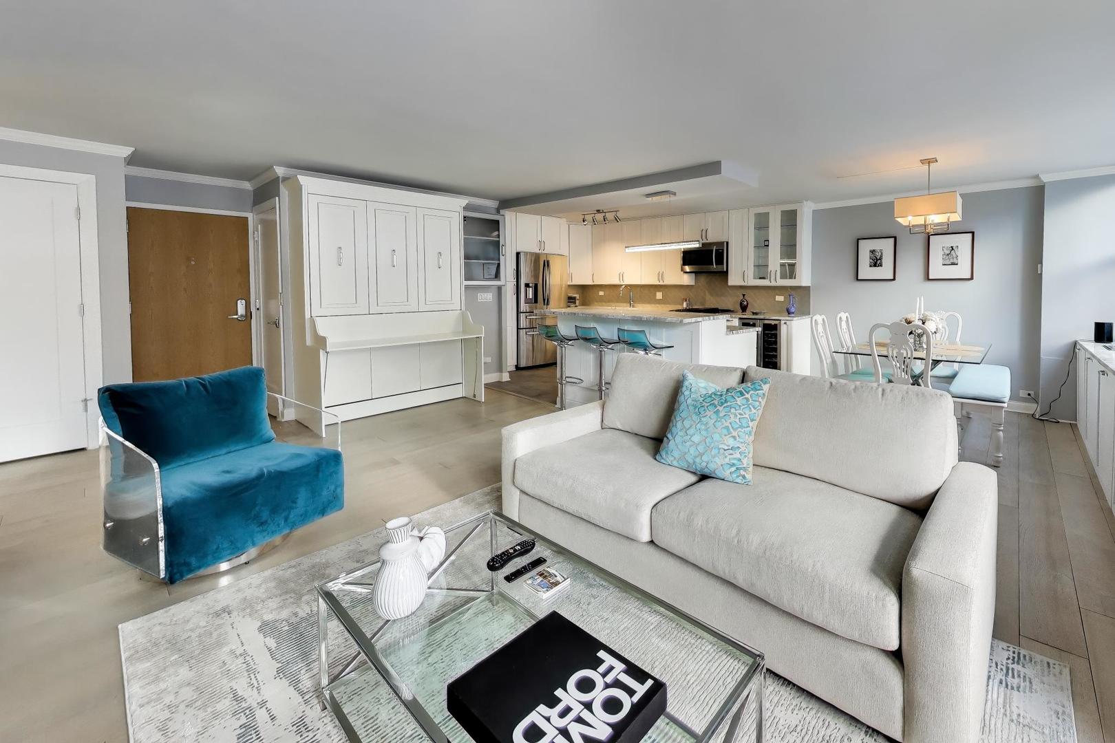 40 East Cedar Street, Unit 18B Chicago, IL 60611 - Photo 5 of 24 a living room with furniture and view of kitchen