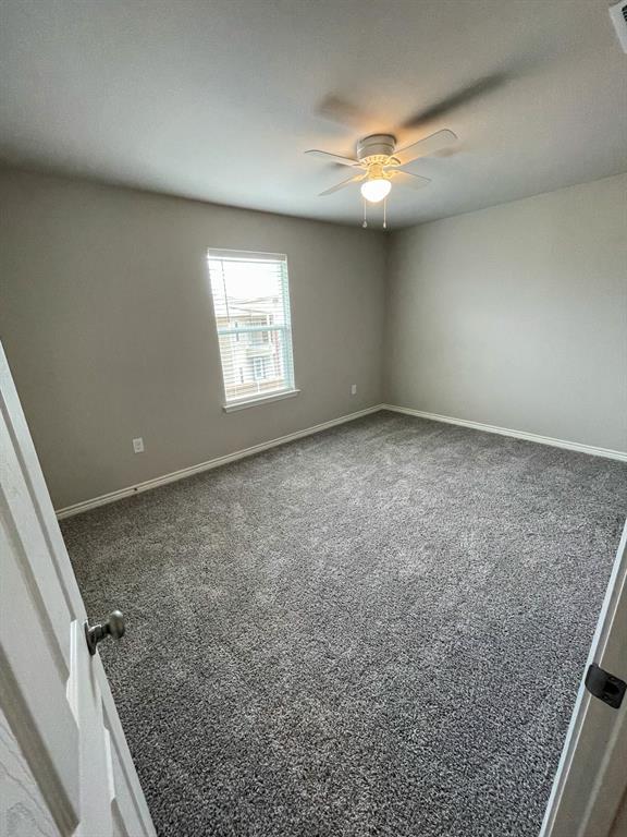2740 Ginger Court Sherman, TX 75092 - Photo 5 of 16 en empty room with windows