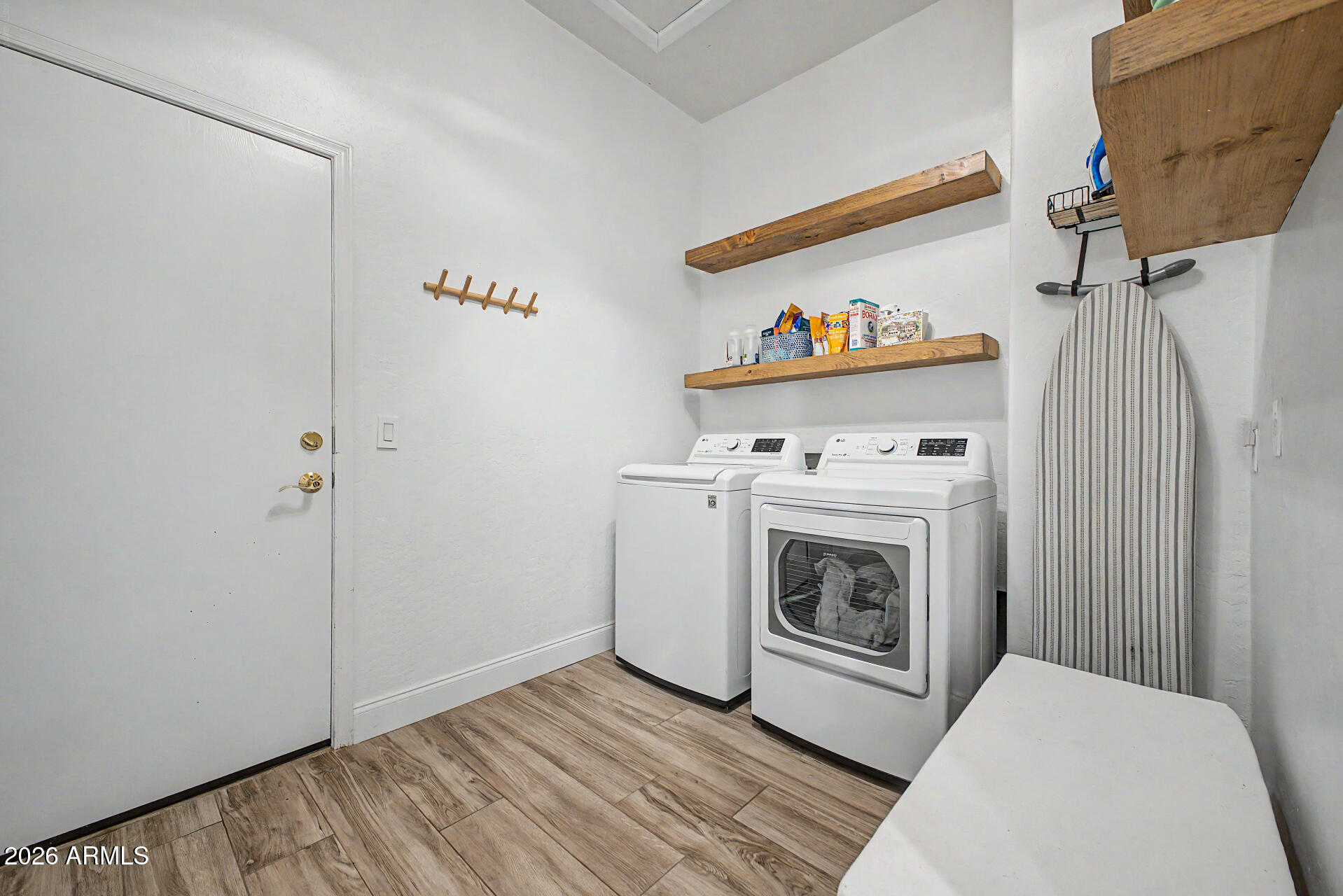4272 East Buckboard Road Gilbert, AZ 85297 - Photo 31 of 37 a view of a livingroom with washer and dryer