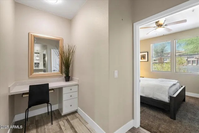 a bedroom with a bed and a table