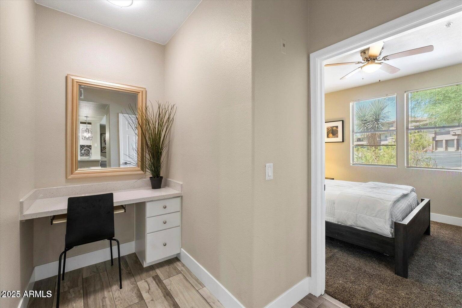 19777 North 76th Street, Unit 1229 Scottsdale, AZ 85255 - Photo 12 of 25 a bedroom with a bed and a table